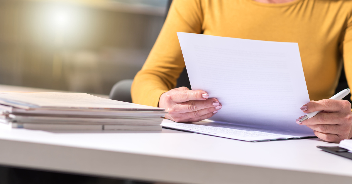 Employer reviewing an employee’s documents to verify right to work in the UK