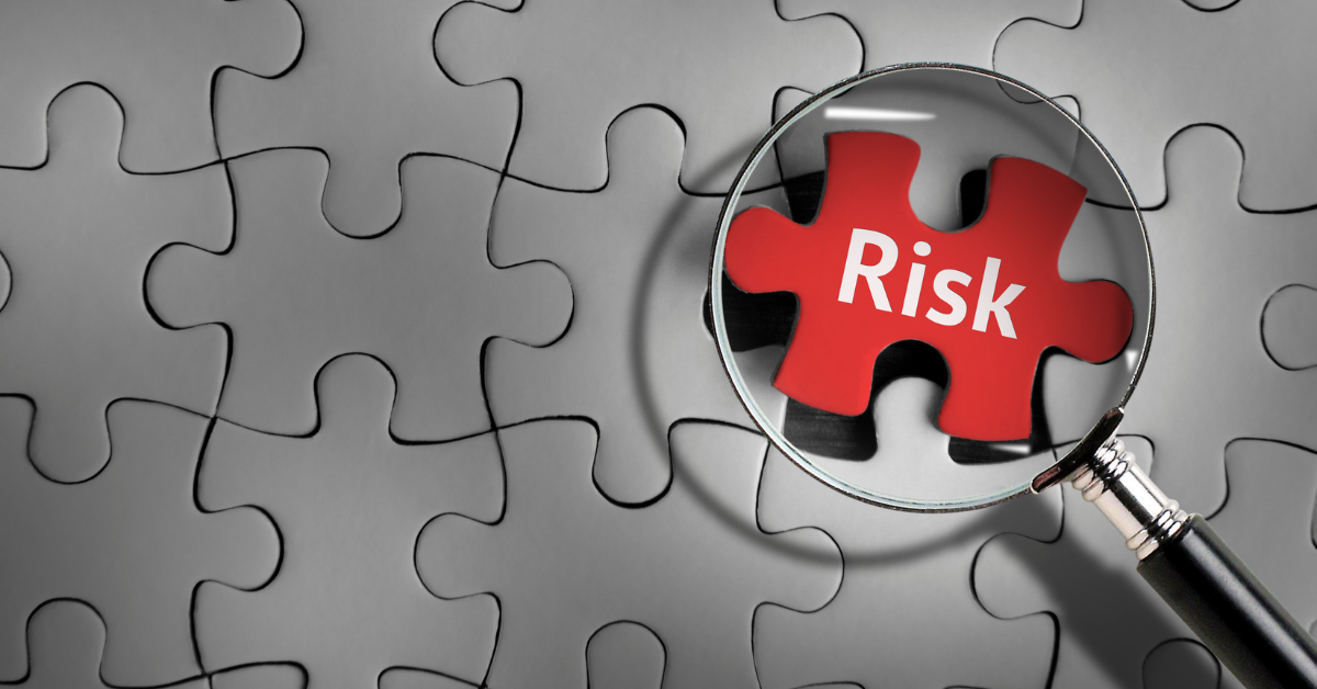 Magnifying glass highlighting a red puzzle piece within an interconnected puzzle, illustrating hidden workforce compliance and labour supply chain risks ahead of the October 2026 Right to Work reforms.
