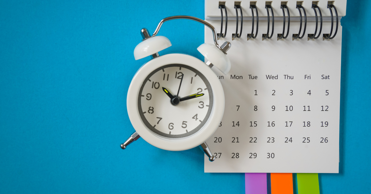 White clock and calendar on blue background symbolising 2024 key Home Office immigration update dates.