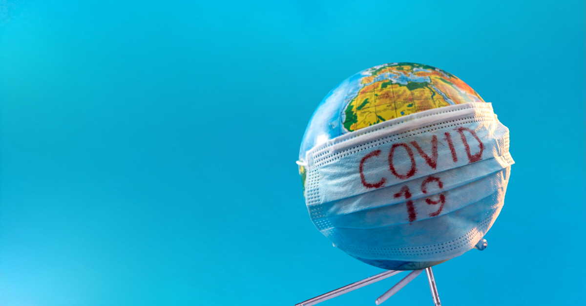 Globe wearing a face mask labelled Covid-19, symbolising global travel restrictions and visa concessions.
