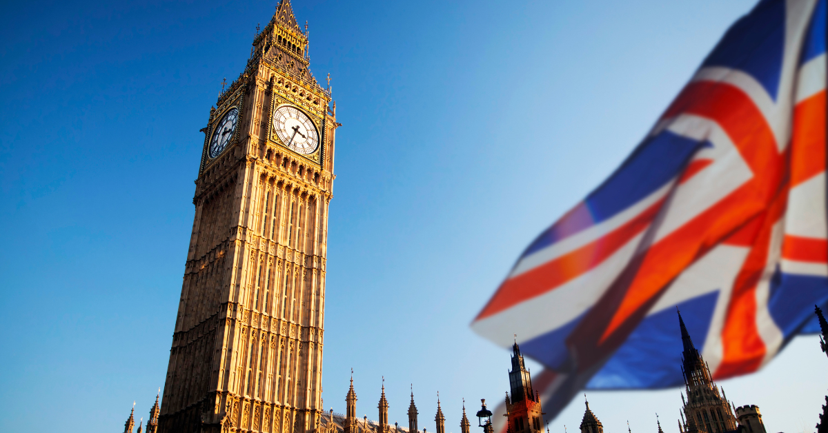 Big Ben and the Union Jack flag representing UK immigration and visa reforms outlined in the 2025 White Paper.